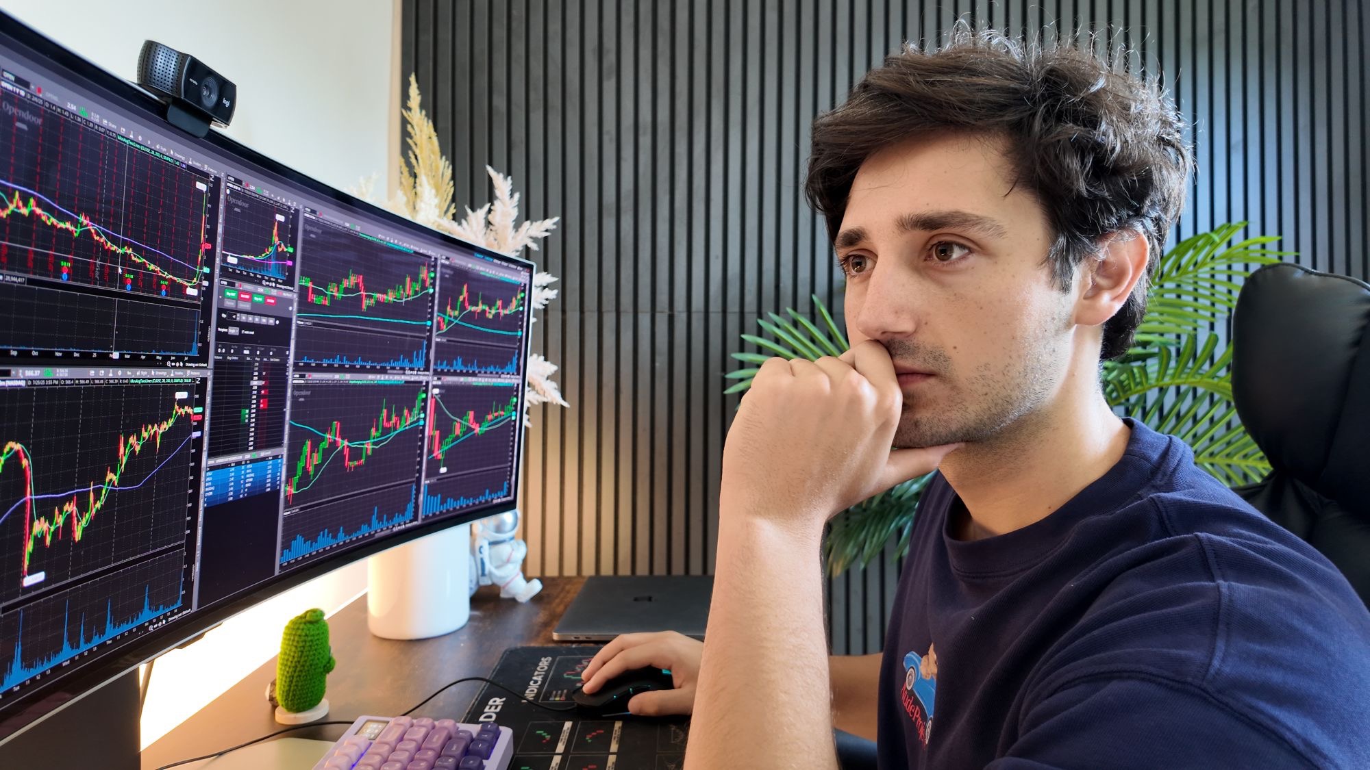 Emmanuel analyzing stock charts